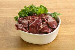 Raw chicken liver in the bowl photo