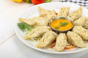 Steamed asian dumpling momo with meat photo