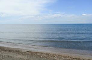 Deserted sea beach. Quiet sea Sea surface landscape photo