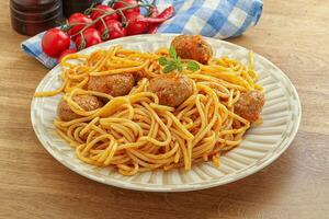 Spaghetti with meatball in tomato sause photo