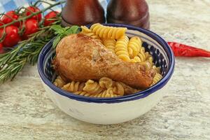 Roasted chicken leg with macaroni photo