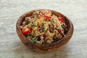 Arabic cous cous with meat and tomato photo