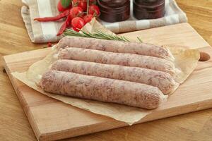 Raw pork sausages for grill photo