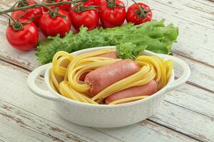 Mini sausages with pasta spaghetti photo