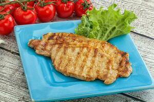 Grilled pork steak with ketchup photo