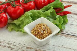 Mustard seeds sauce in the bowl photo