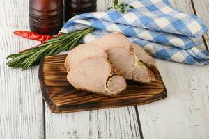 Baked pork tenderloin served rosemary photo