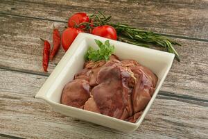 Raw chicken liver in the bowl photo