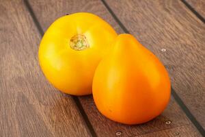 Ripe yellow bright juicy tomato photo