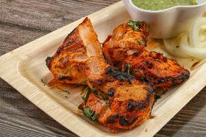 Indian cuisine - tandoori chicken tikka photo