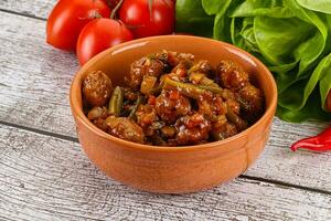 Meatball with vegetables and spices photo