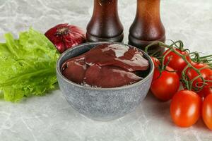 Raw turkey liver in a bowl ready for cooking photo