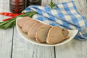 Baked pork tenderloin served rosemary photo