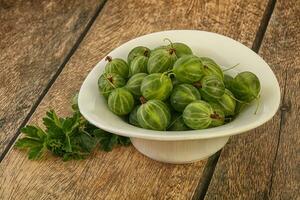 Natural ripe gooseberry heap in the bowl photo