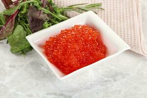 Red caviar in the bowl photo