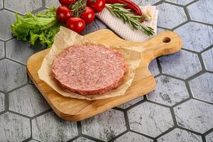 Raw beef uncooked burger cutlet photo