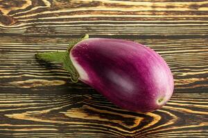 Raw purple ripe eggplant for cooking photo