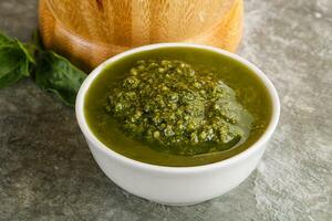 Homemade vegetarian basil pesto sauce photo