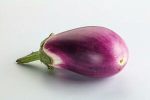 Raw purple ripe eggplant for cooking photo