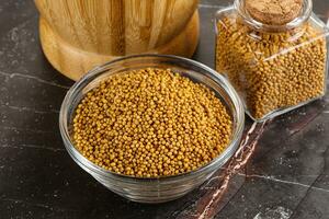 Mustard dry seeds in the bowl photo