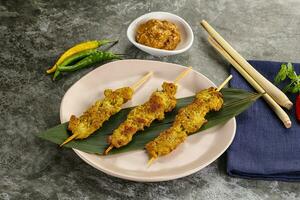 Thai meat skewer Satay with sauce photo