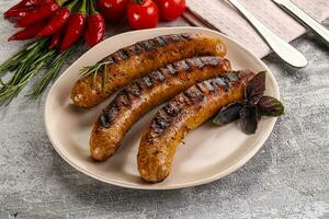 Grilled meat sausages with spices photo