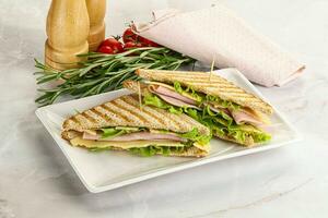 Homemade club sandwich with ham and cheese photo