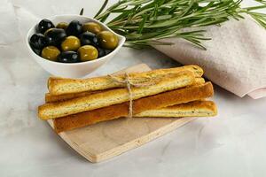 Crispy grissini italian bread heap photo