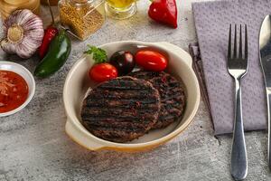 Grilled burger cutlet with sauce photo