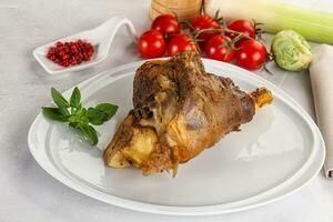 Baked Lamb shank with bone photo