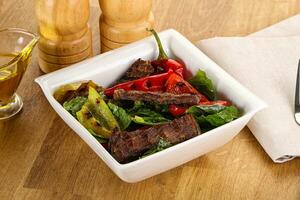 Salad with grilled beef steak photo