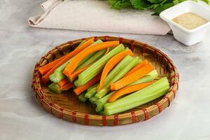 Vegan cuisine - dietary celery and carrot cticks photo