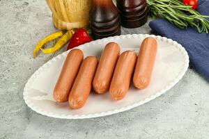 Boiled sausages for breakfast photo