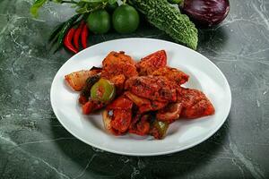 Indian cuisine - chicken tikka barbecue photo