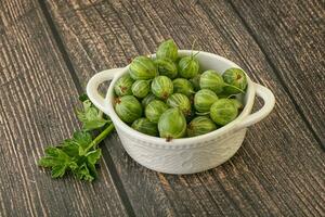 Natural ripe gooseberry heap in the bowl photo