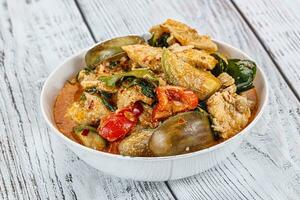 Thai red spicy curry with chicken photo