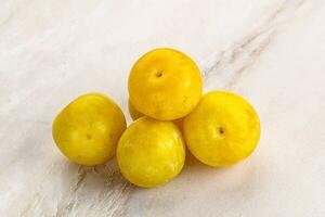 Yellow sweet plum heap fruit photo