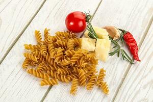 Raw whole grain pasta fusilli photo