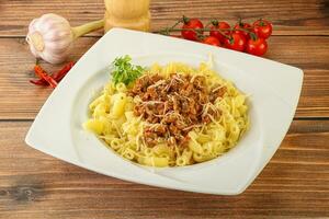 Bolognese pasta with beef meat and cheese photo