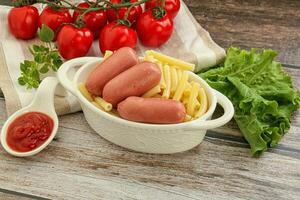 Mini sausages with pasta macheroni photo