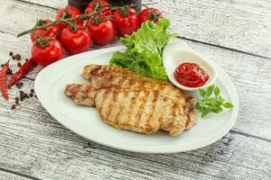 Grilled pork steak with ketchup photo