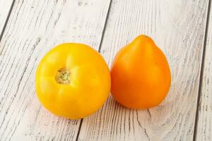 Ripe yellow bright juicy tomato photo