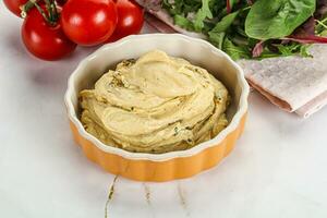 Creamy hummus in the bowl photo