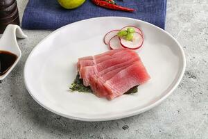 Japanese cuisine - sliced tuna sashimi photo