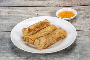 Traditional crispy fried stuffed springroll photo