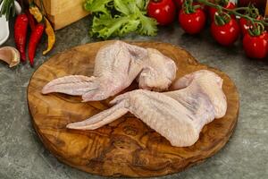 Raw chicken wings foe cooking photo
