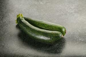 Raw young small green zucchini photo