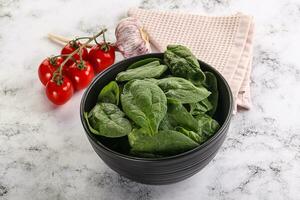 Green spinach leaves in the bowl photo