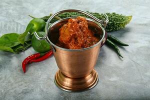 Indian cuisine - butter chicken with sauce photo