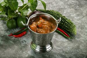 Indian cuisine - chicken curry with spices photo